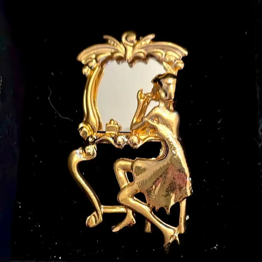 REFLECTION IN MIRROR BROOCH‎